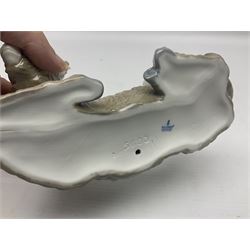 Lladro figures of animals, comprising Mini Lion no 5436, Beautiful Burro no 5683, Hawk Owl no 5422, Beagle Puppy Sitting no 1071, Duck Flying no 1264, Miniature Cat no 5308 and Small Papillon Dog no 4749, four with original boxes, largest example H14cm