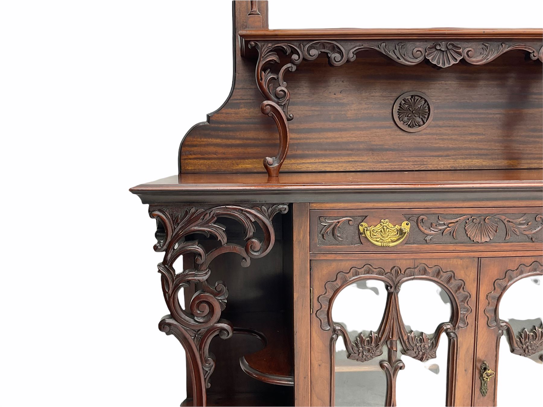 Late Victorian Empire style walnut mirror back sideboard, two glazed centre cupboards with drawer drawer