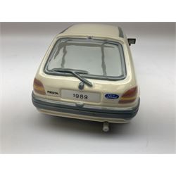 Lladro figure, Ford Fiesta, modelled as a Ford in beige, special commission by the Ford factory in Valencia, original box, no 7608, year issued 1989, year retired 1989, H9cm 