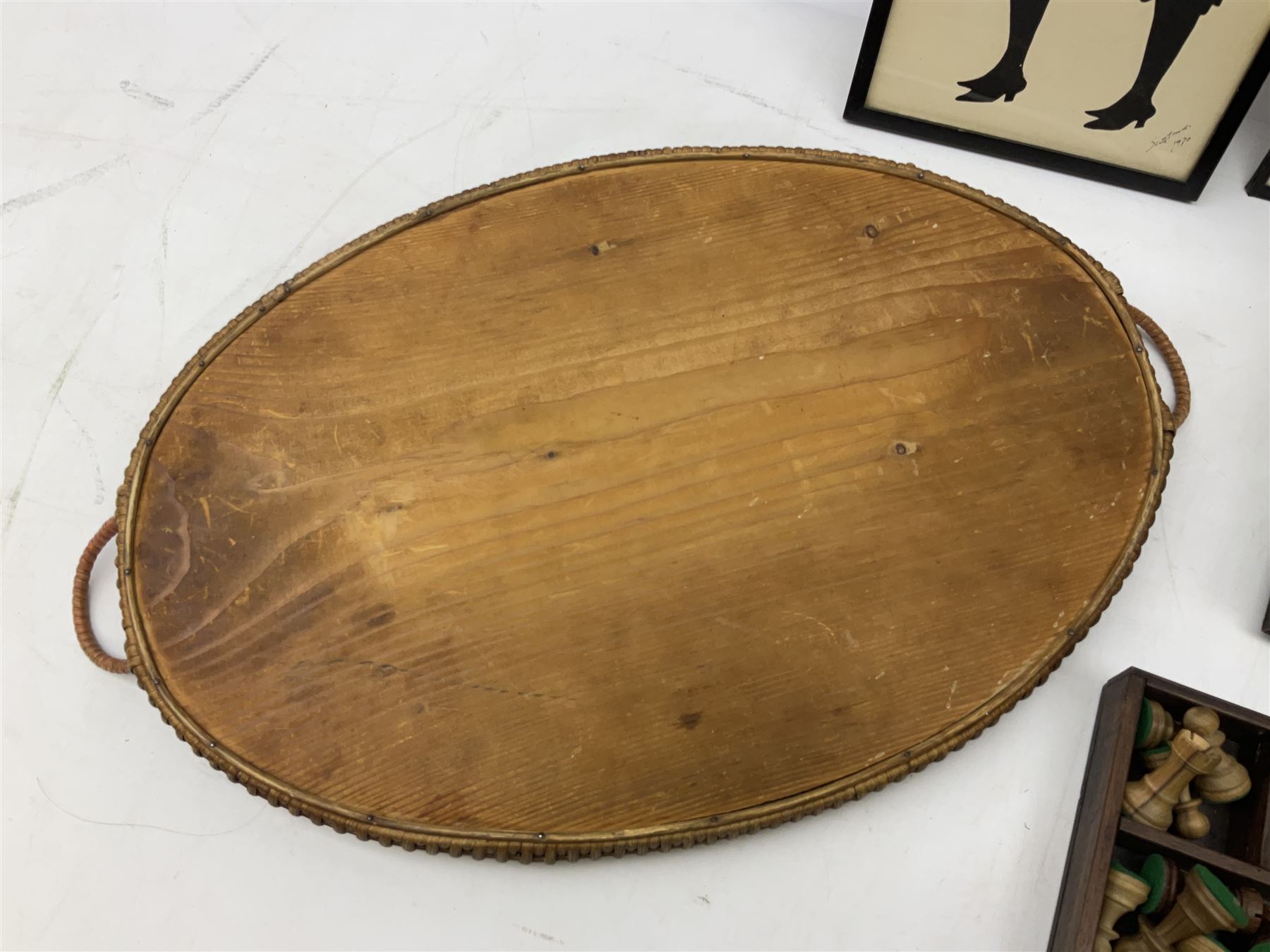 Two Scott-Ford framed silhouettes, featuring the standing profile study of a man dated 1929 and a pair of women dated 1929 and 1930, together with a box containing wooden chess pieces and a serving tray 