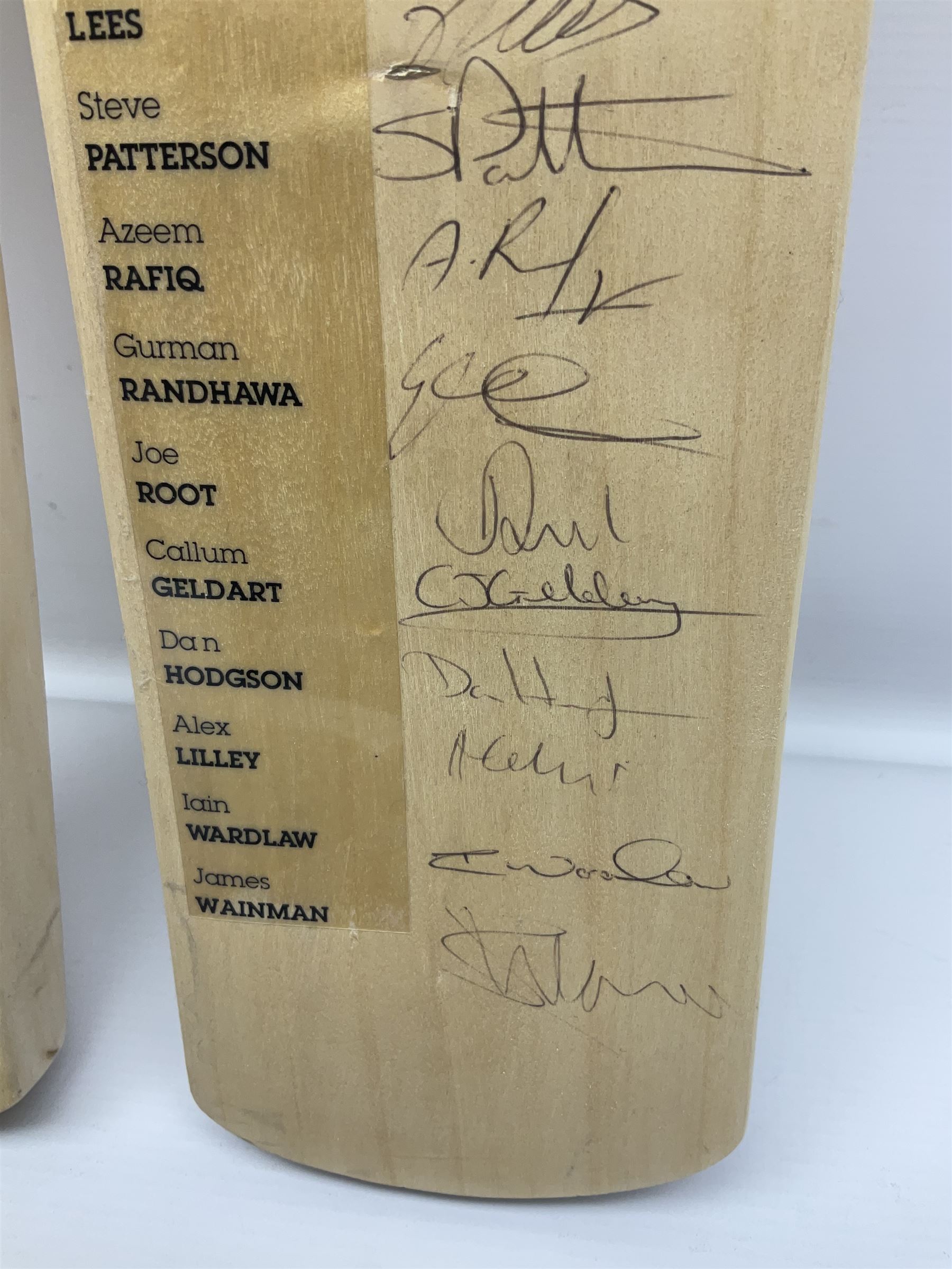 Two signed Yorkshire County cricket bats, from 2011 and 2012 seasons, bearing signatures including Adil Rashid, Andrew Gale, Ryan Sidebottom, Gary Ballance etc