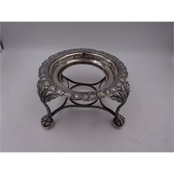 George IV Scottish silver spirit kettle stand, of circular form, the rim embossed with fruiting vines, upon four leaf mounted claw and ball feet, hallmarked William Cunningham, Edinburgh probably 1827, H9cm, D17.5cm