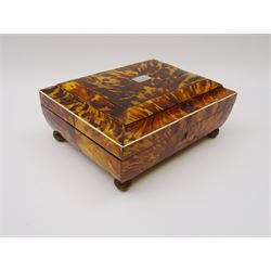 19th century tortoiseshell sewing box, of sarcophagal form upon four foliate detailed brass ball feet, the hinged cover edged in ivory with initialled silver plaque to centre, opening to reveal a silk lined interior, H9.5cm W22.5cm D18cm