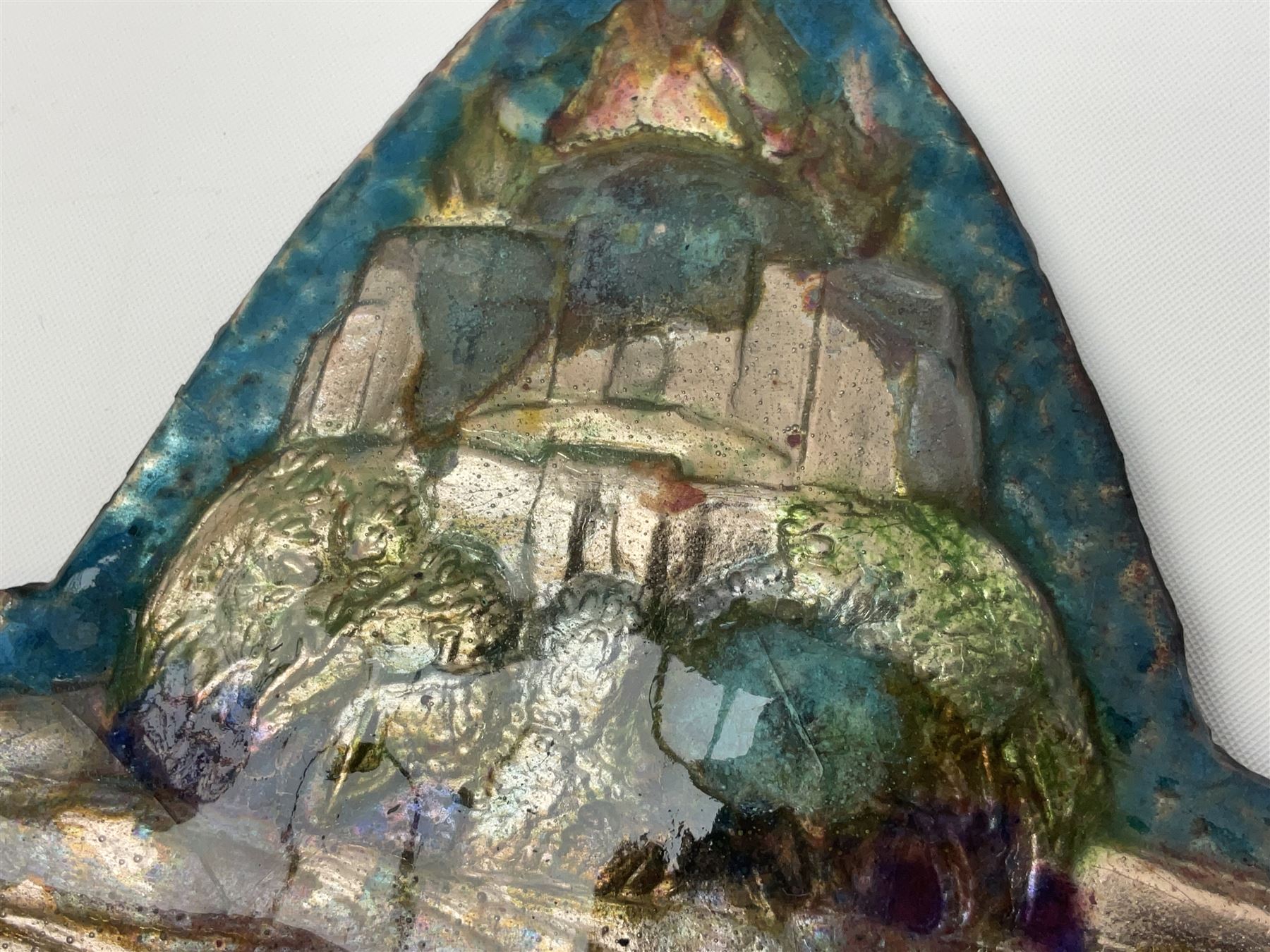 Henry George Murphy (1884-1939), Arts & Crafts enamel panel, of stylised form decorated with a stylised temple on a hill, upon a blue toned ground, H13cm W15cm