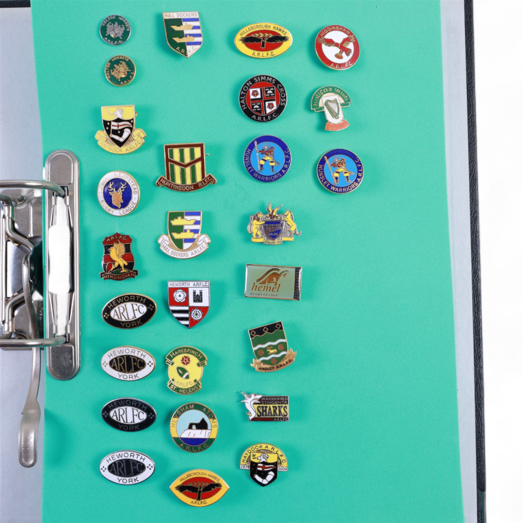 Amateur rugby league enamel badge collection, teams including Birmingham Bulldogs, Bridlington, Dudley Hill, Duke of York, Edinburgh Eagles, Guiseley, Rangers, Huntingdon, Keighley Town, Leigh Miners, Pilkington Recs, St Josephs, Thornhill Trojans, West London Sharks etc, all displayed in three folders and six amateur league badges from Leeds & District, Hull & District, York & District, Warrington, Lancashire County and Yorks County in box display, (approximately 270)