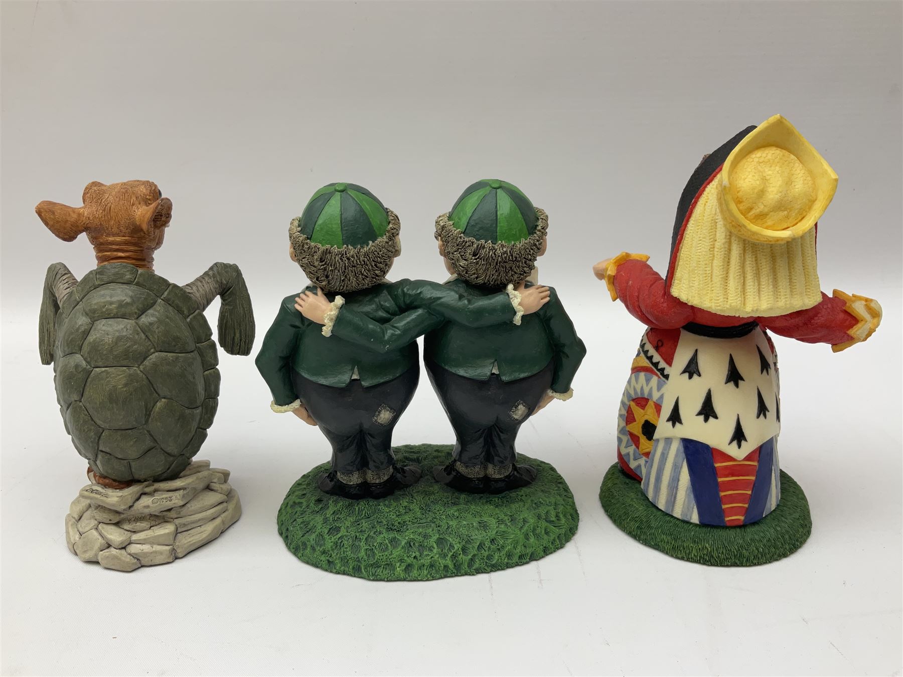 Goebel Alice in Wonderland figures, comprising Alice and Cat, White Rabbit, Queen of Hearts, March Hare, Tweedle Dee and the Mock Turtle, largest H18cm