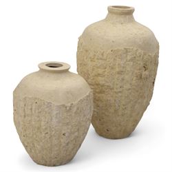 Two Mactan composite stone vases, of rounded tapering form with textured lower bodies and smooth necks

(Smaller vase H 64cm, W 45cm)