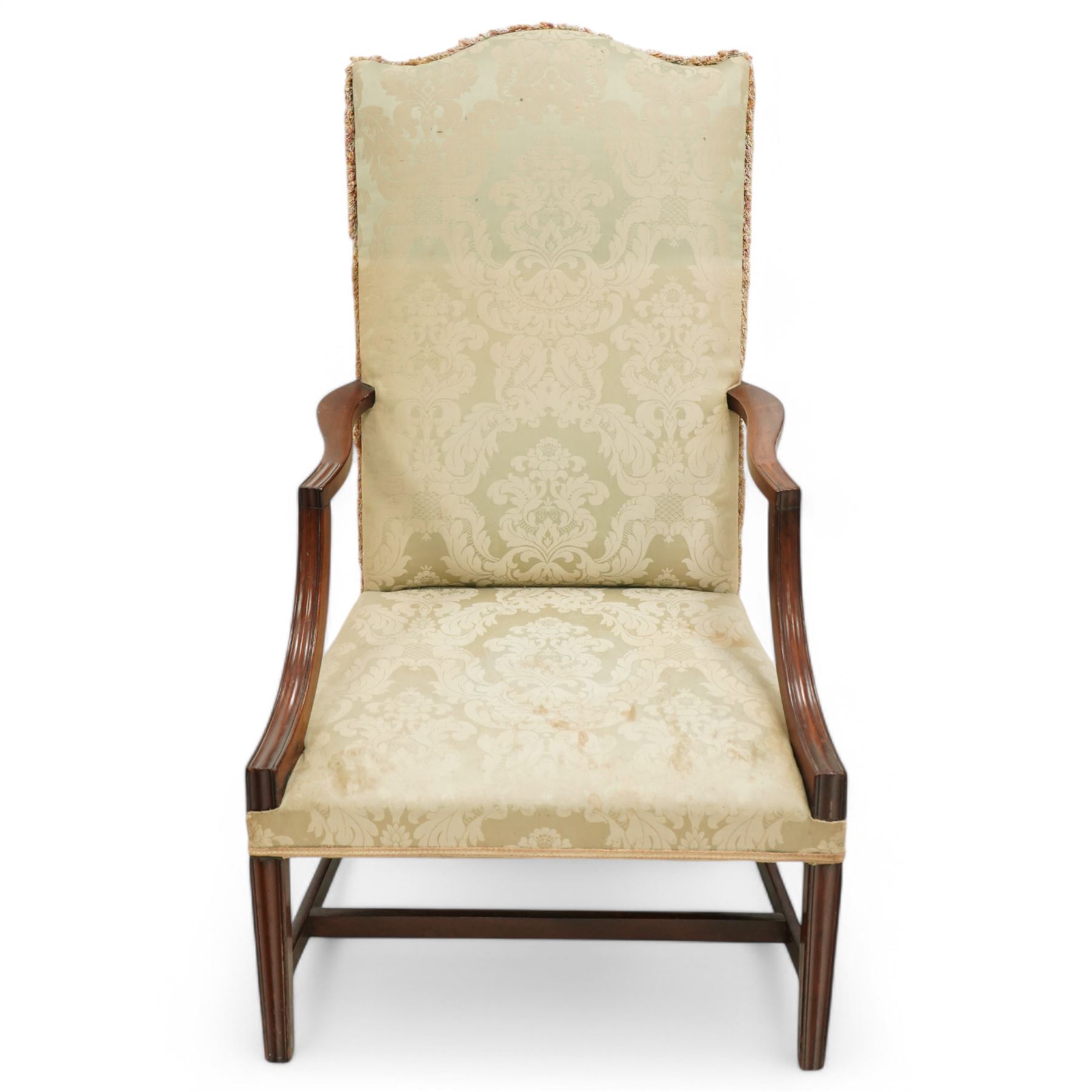 Georgian design mahogany framed Gainsborough armchair, arched cresting rail over shaped arms on curved and moulded supports, upholstered in pale green fabric with repeating foliate pattern, on square tapering moulded supports united by plain stretchers 
