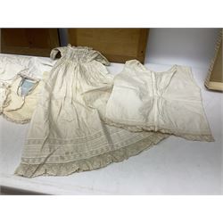 Late 18th century sampler worked with the alphabet above verses in red, by Mary Birkett aged 10 November 16th 1792, H33.5cm W34.5cm, together with another sampler worked with the alphabet above Proverbs 14:23, by Mary Anne Hainworth, Chesham, date unknown (--83), both in glazed frames, together with a quantity of Victorian and later dolls clothes to include lace examples