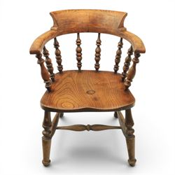 Early 20th century elm smoker's bow or captain's chair, elm dished seat raised on turned supports