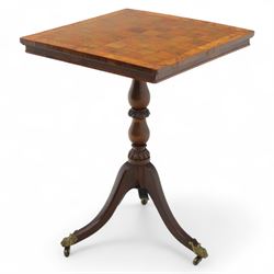 Early 20th century walnut chess table, square checkered veneered top with crossbanded edge, raise on a turned column based with acanthus craving, on three outswept legs terminating in brass paw caps above castors
