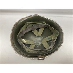 1950s French Algerian War steel helmet with liner; indistinctly marked 'S.I.A. LE EANS(?) 71R'