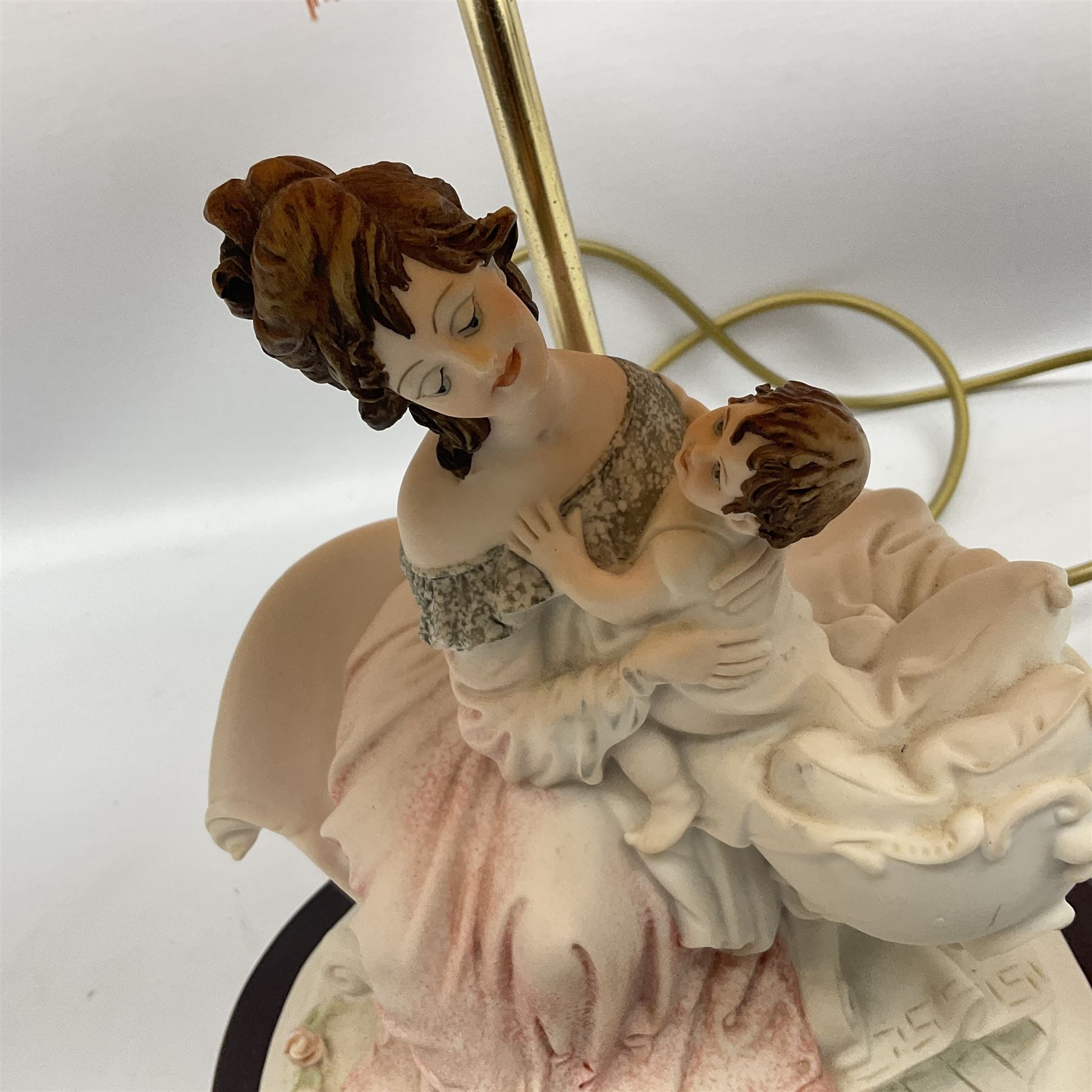 Capodimonte figural table lamp modeled as a woman and baby, signed B.Merli, with a tasseled shade, H59cm