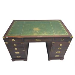 Military style mahogany twin pedestal desk, rectangular top with green inset, fitted with eleven drawers, recessed brass handles and brackets, on bracket feet