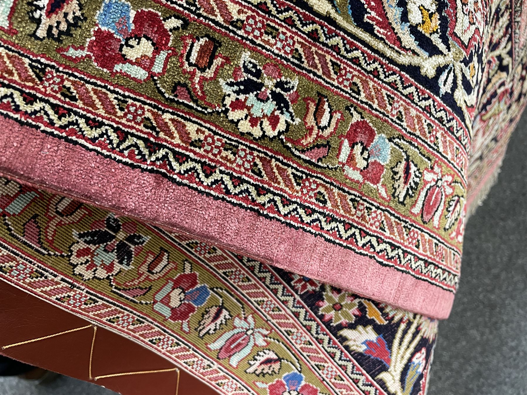 Finely knotted Persian Qom silk rug, overall pink ground with ivory field, the field with central cusped medallion profusely decorated with interlacing foliate and stylised flower heads, multiple band boarder, the main band decorated with a series of stylised motifs and trailing foliage, the outer guard with signature panel 