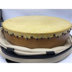 Dulcet eight-string banjo mandolin with mother-of-pearl inlaid ebonised fingerboard L55.5cm; cased; and Irish mahogany bodhran hand drum with inlaid stringing and vellum top D46.5cm; in soft carrying case with double ended beater (2)