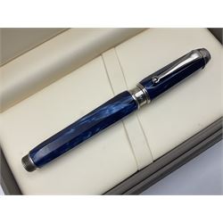Montegrappa Emblema fountain pen, the blue pearl marbled barrel of octagonal form with silver mounts stamped 925 and silver mounted cap with 1912 emblem and clip with roller, in box, L13.5cm