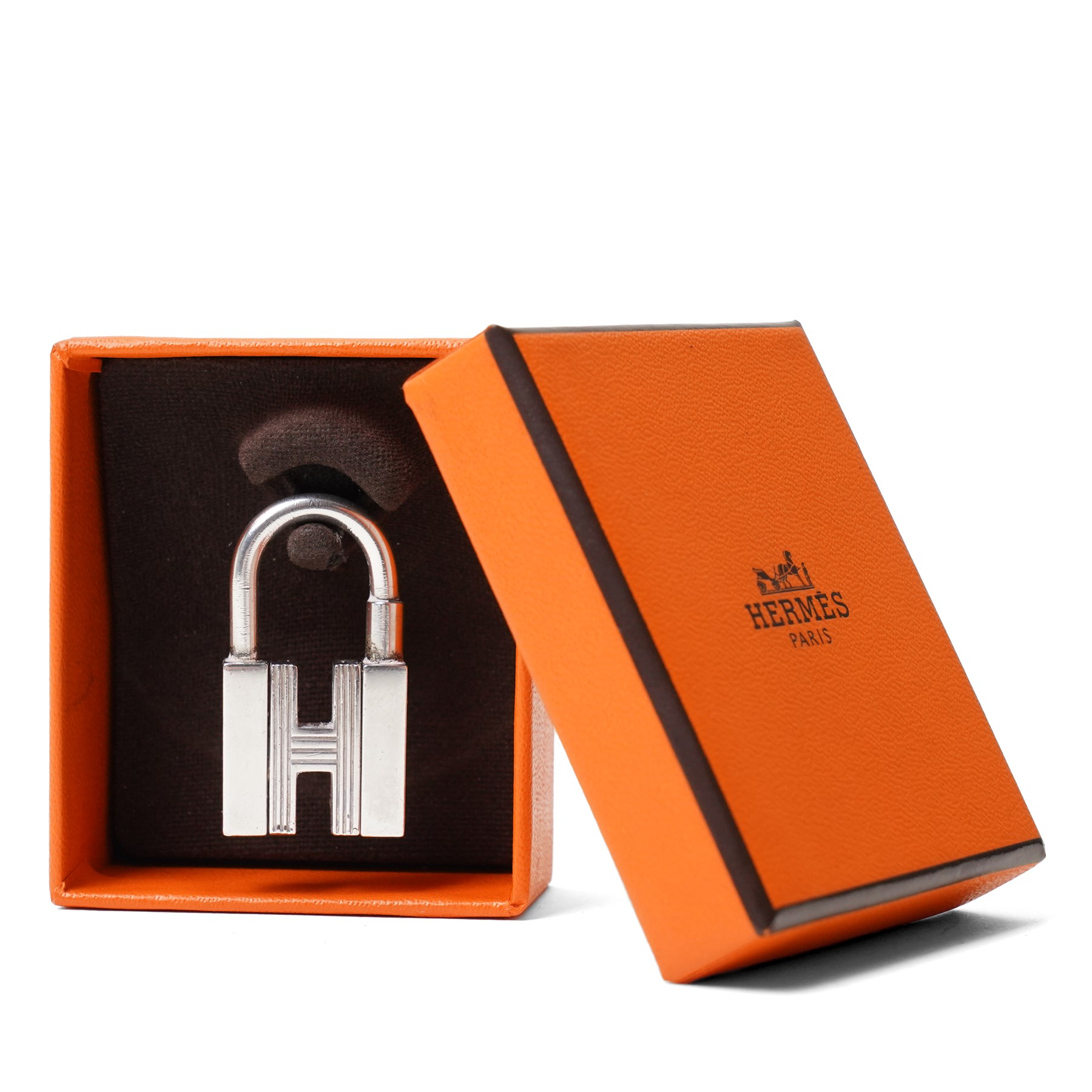 Hermès - sterling silver Cadena H padlock charm, modelled as the letter H with hinged shackle, stamped Hermès and with French silver assay mark, with original  box
