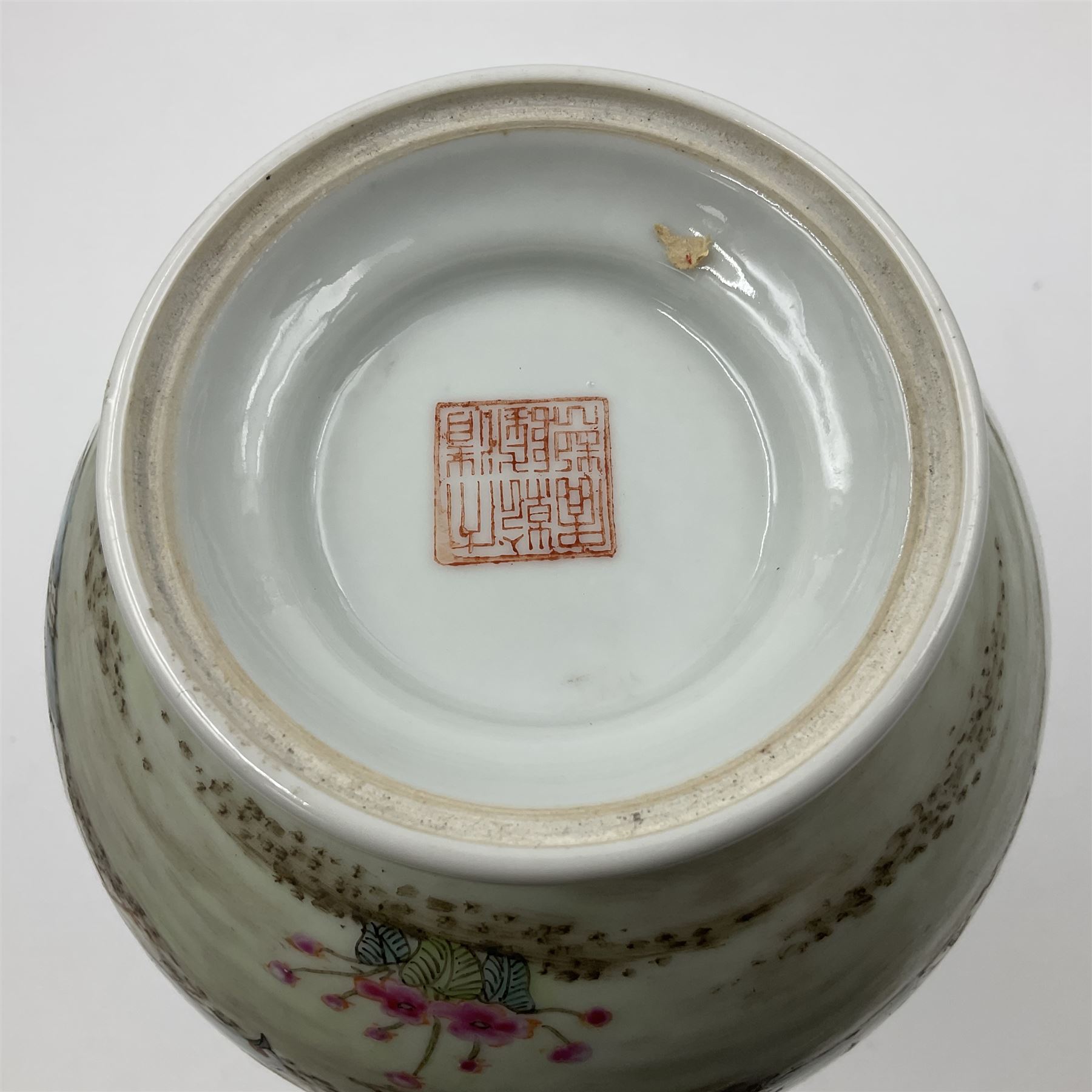 Pair of Chinese Republic porcelain vases, each painted in Famille Rose enamels with pairs of pigeons amidst peony, rock, flowering plants and leafy branches, possibly Qianlong seal beneath, H22cm 