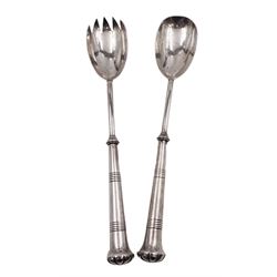 Pair of Arts & Crafts silver salad servers, each with tapering cylindrical handle, hallmarked William Hutton & Sons Ltd, London 1901, L27cm