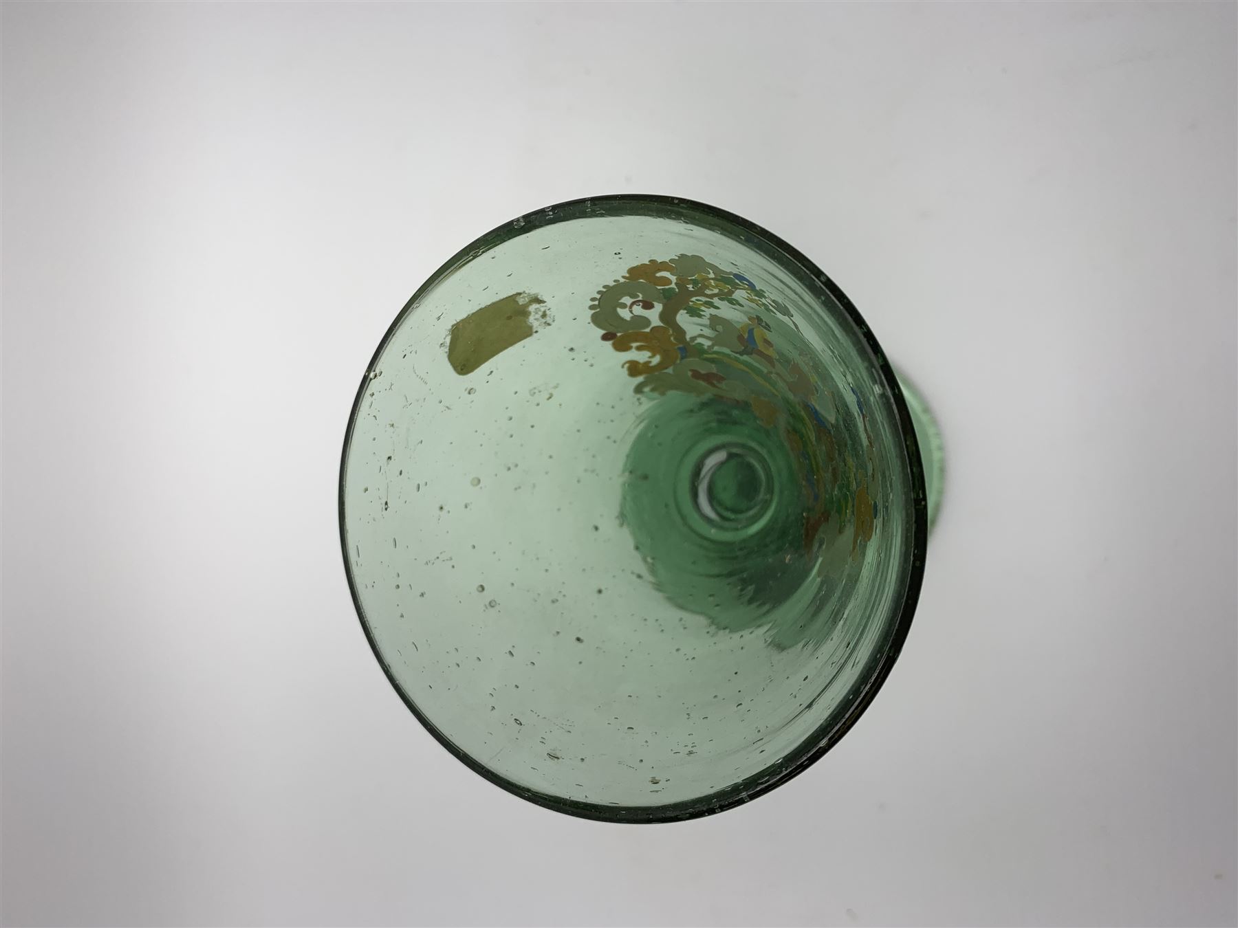 19th century bohemian green glass wine glass, the funnel bowl decorated in enamells with a Historismus hunting scene in the manner of Egermann & Lobmeyr, upon a baluster stem and circular foot, H14.5cm