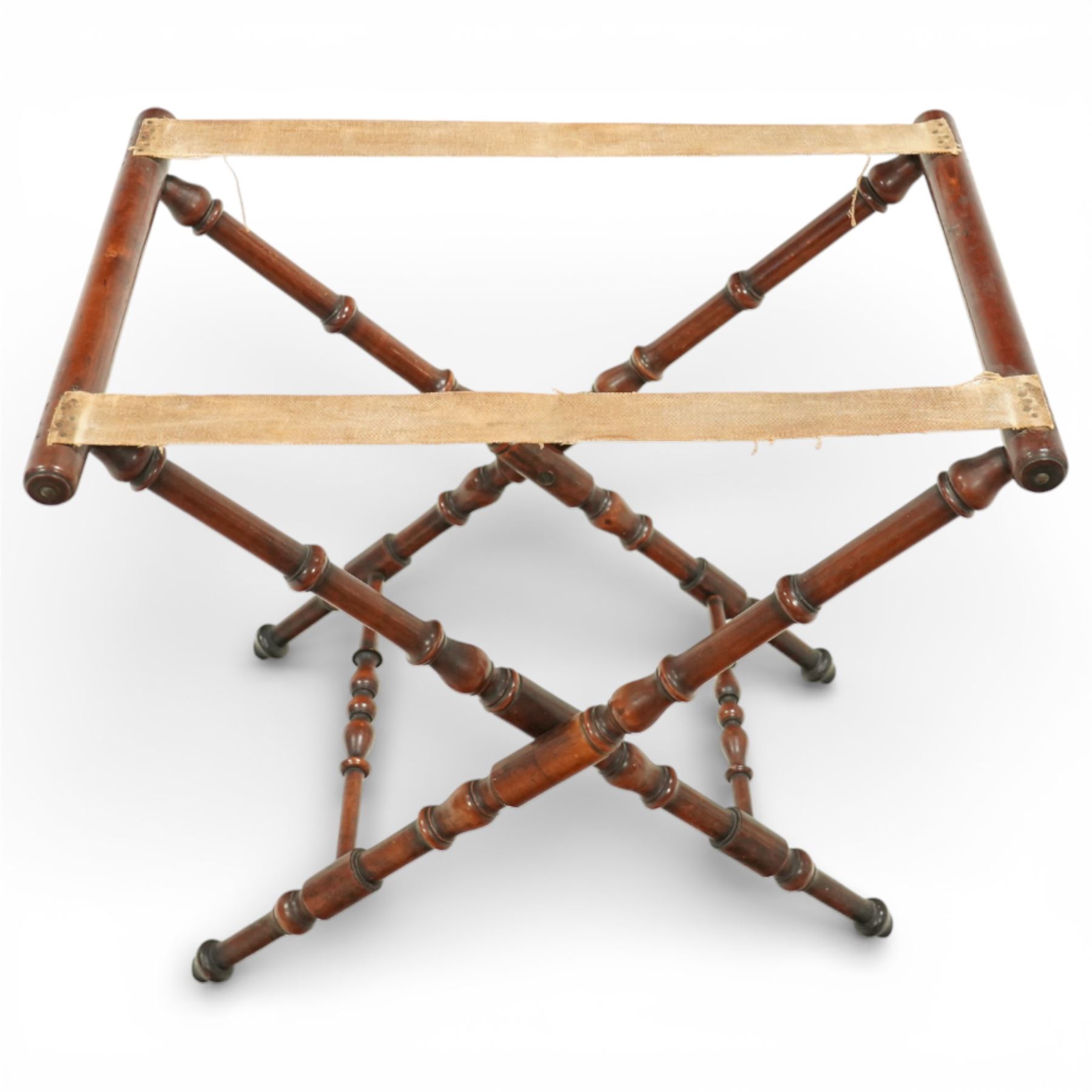 19th century coaching table, the rectangular tray top with shaped gallery and cut out carrying handles, raised on a folding X frame stand with turned supports and stretcher rails