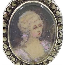 19th century French 18ct gold and silver marcasite portrait ring, set with an oval miniature of a woman on ivory, under glazed panel, with marcasite surround and trifurcated shoulders, hallmarked. This lot has been registered for sale under Section 10 of the APHA Ivory Act