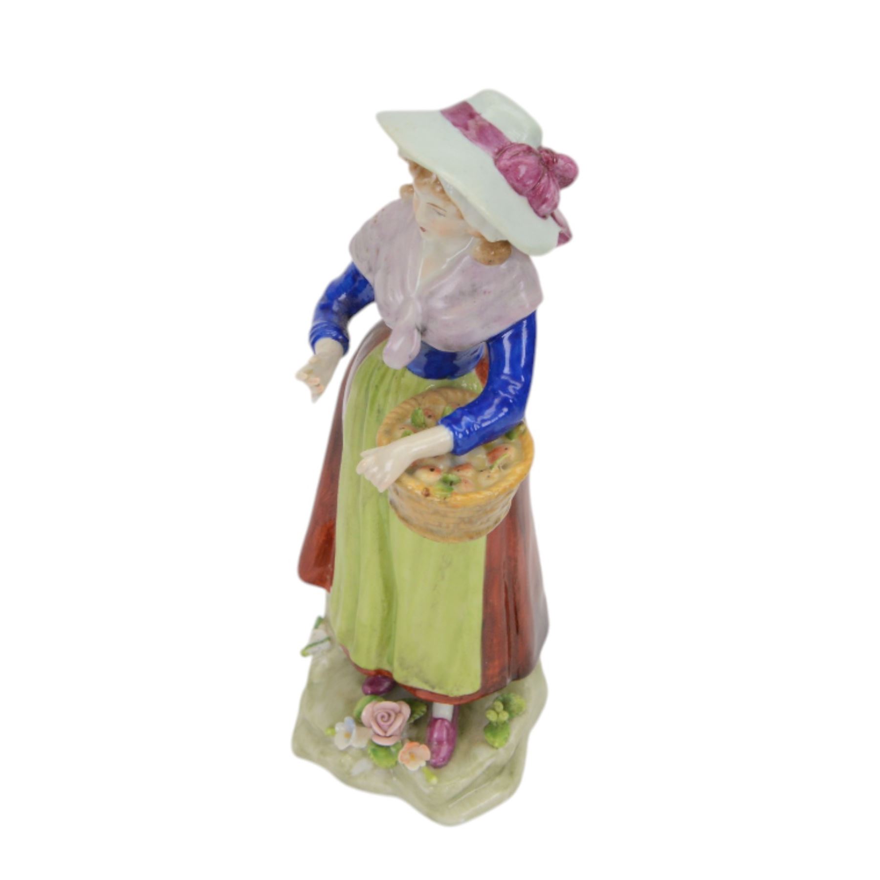 Sitzendorf figure modelled as a shepherdess, together with pair of apple sellers and other continental figures