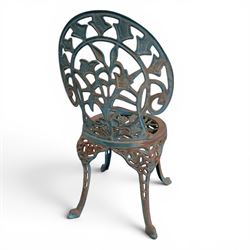 Cast iron garden table and four chairs, in the Art Nouveau style, with pierced floral and foliate decoration throughout, circular table raised on four cabriole legs with stretcher ring, chairs with shaped openwork backs and seats, in a weathered green finish