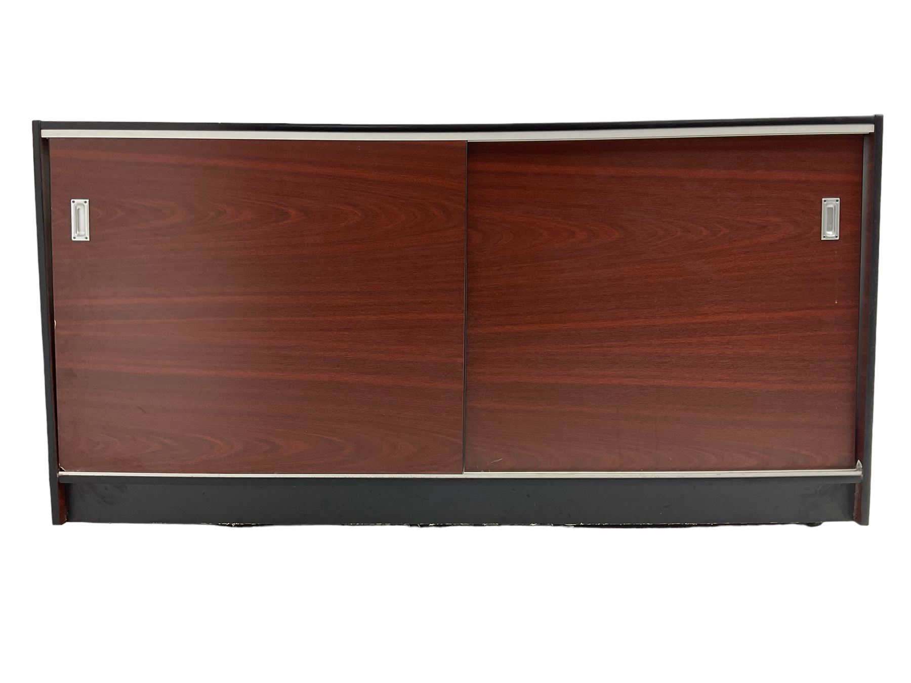 Shop display cabinet counter, glazed front and top, with mahogany laminate sides and back, enclosing two long adjustable shelves, fitted with two sliding cupboard doors to the rear, on castors