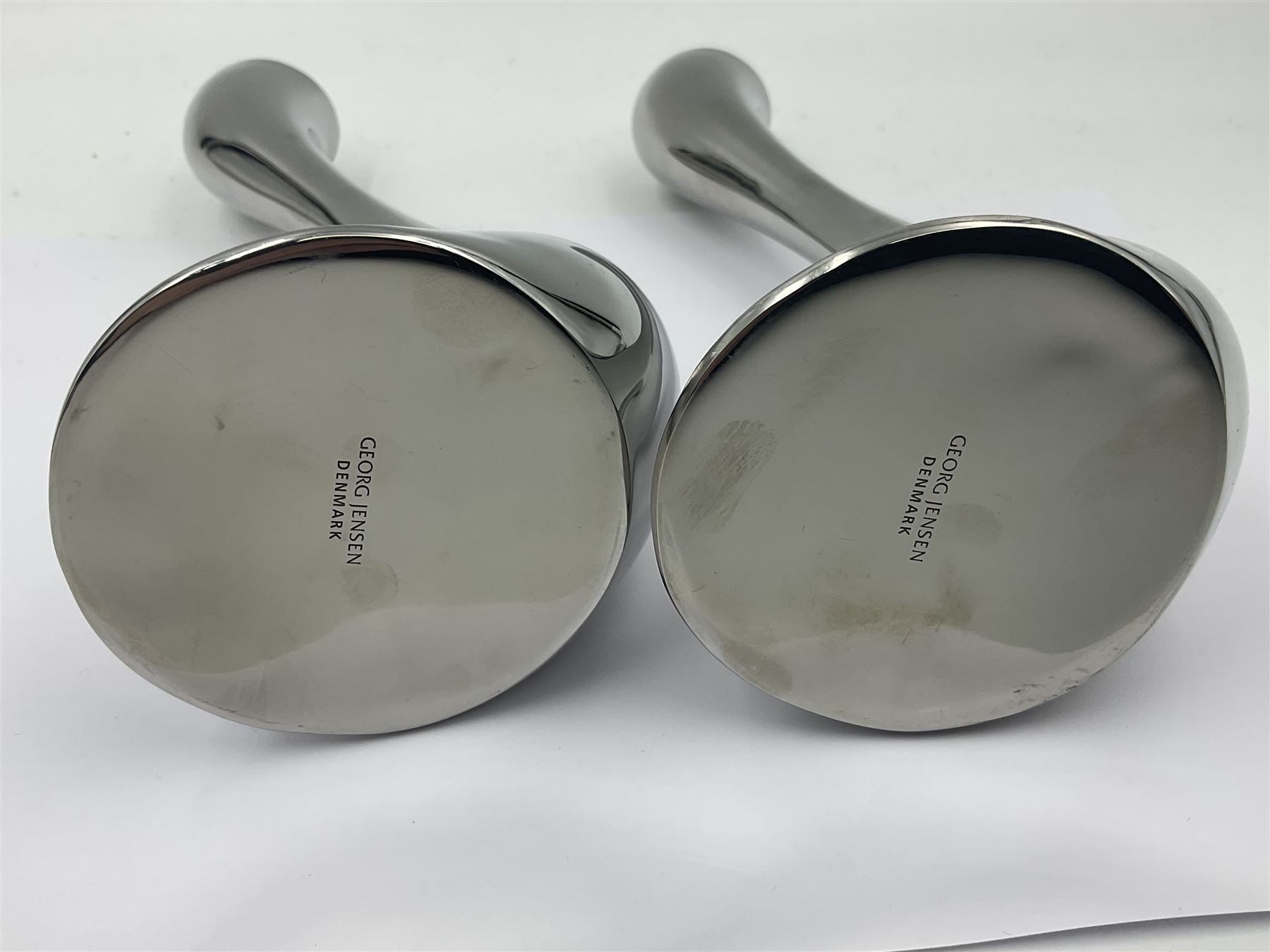 Pair of Georg Jensen chrome 'Cobra' candlesticks, with stamped maker's mark to base, H20cm