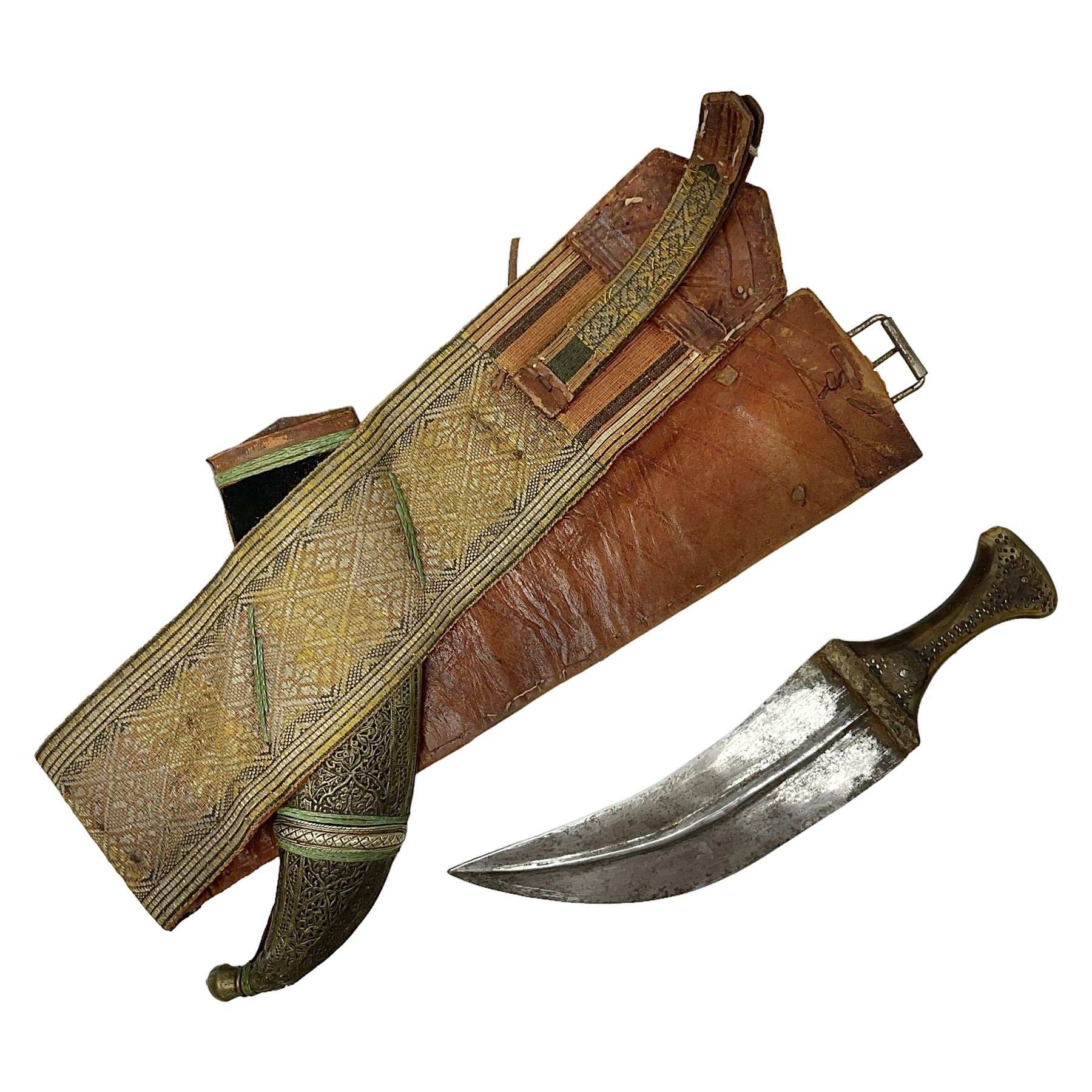 Late 19th century Yemeni Tuza jambiya as worn by religious elite, the 20.5cm curving blade with raised medial ridge, the horn hilt with pique style studwork, in a leather wrapped wooden scabbard with pierced metal mount and leather belt applied with embroidered 'gold' and 'silver' thread work panel; dagger L36cm overall, belt L84cm