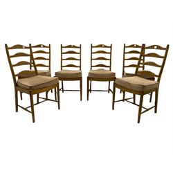 Ercol light elm oval extending dining table, with butterfly leaf, and six ladder back chairs