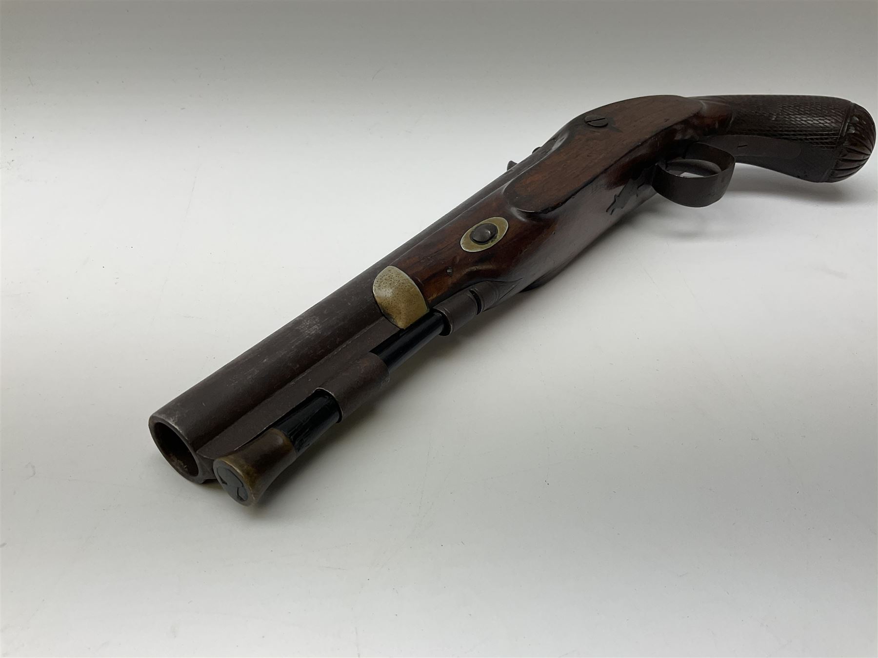 19th century flintlock converted to percussion cap target pistol, the 20.5cm barrel engraved with a sunburst motif to the top and ramrod under, foliate engraved lock-plate and trigger guard, silver plated fittings, walnut stock with chequered grip and melon fluted butt L35.5cm overall
