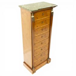 Neoclassical marble and inlaid figured maple wood tall chest, green marble inverted-breakfront top over eight long drawers, flanked by square tapering pilasters with gilt metal female bust and anthemion leaf capitals and brass feet terminals, the skirted base with applied Medusa gilt metal mounts, on compressed bun feet