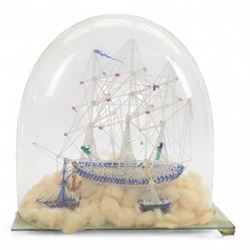 Victorian glass frigger of a three mast ship and a smaller ship under a glass dome, H38cm