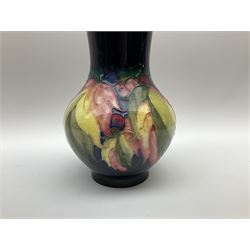Moorcroft vase of bulbous form, circa 1928-1949, decorated in the Leaf and berry pattern upon a dark blue ground, with impressed marks beneath, H17cm