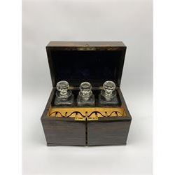 19th century coromandel decanter box, of rectangular form, the hinged cover with vacant central plaque opening to reveal three octagonal and hobnail cut decanters with flat topped stoppers, the front doors opening to reveal a satinwood compartment for seven glasses, H23.5cm L33.5cm D21cm 