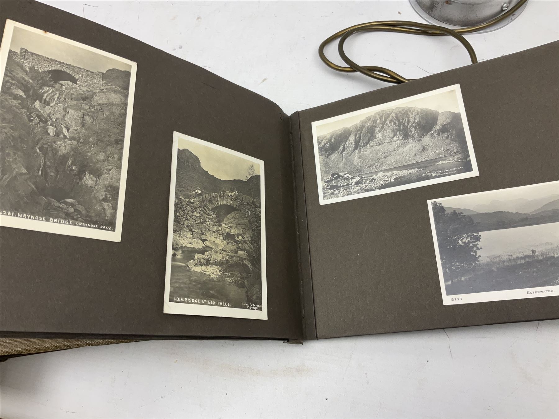 Quantity of post cards in six albums, local interest and photographic postcards, together with an art deco style table lamp