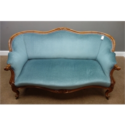  Victorian rosewood framed settee, shaped cresting rail with floral carving, scrolled arm supports and cabriole legs, serpentine front, upholstered in blue, W161cm, D83cm  
