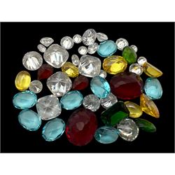 Collection of loose cubic zirconia stones, in various shapes and colours