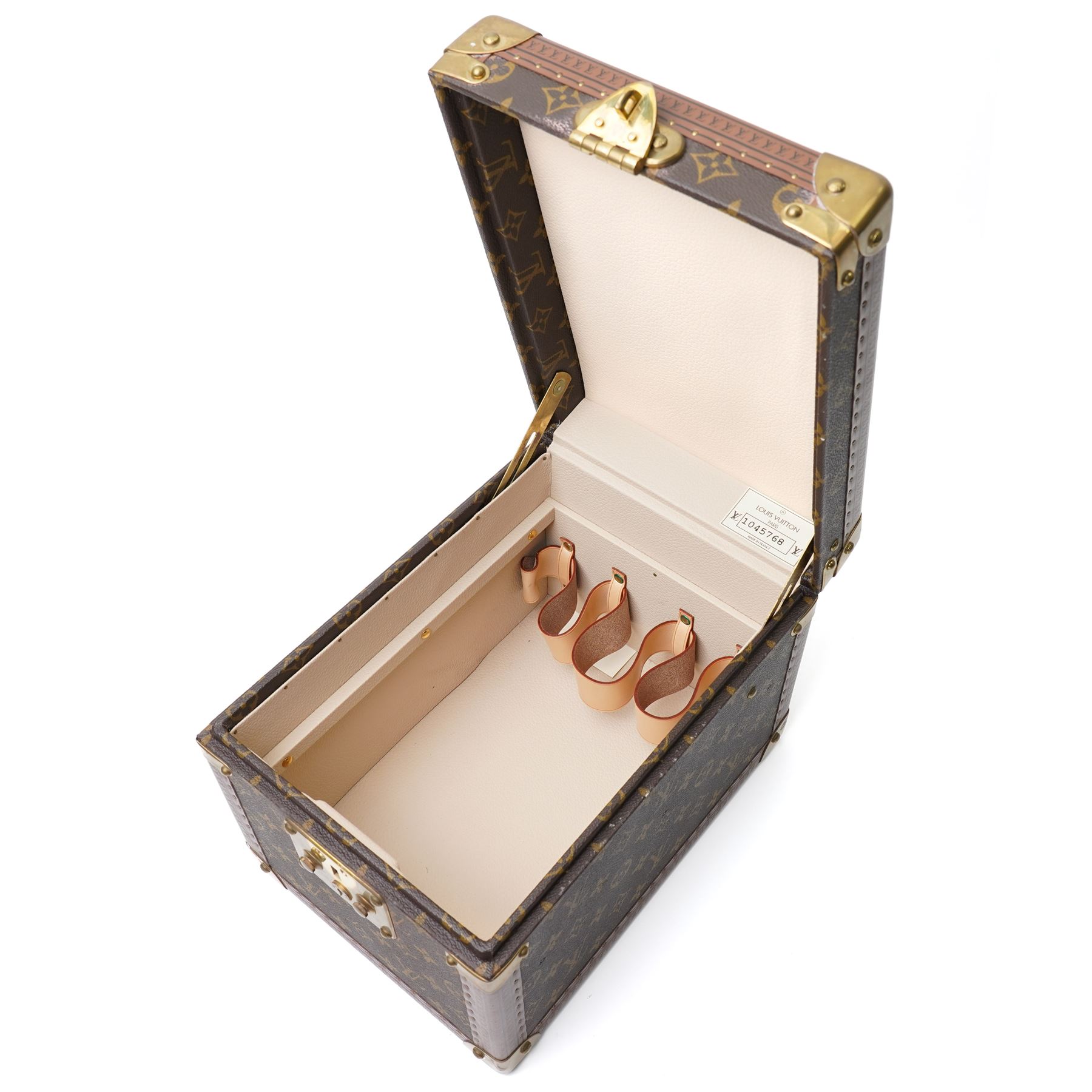 Late-20th century Louis Vuitton monogram Boîte Flacons vanity coffret, monogram canvas with lozine trim and brass mounts, single front brass lock stamped Louis Vuitton with key code 1247413, the interior fitted with leather flacon retaining loops and lift-out lidded tray with leather handle, label to interior printed Louis Vuitton Paris serial number 1045768, together with two keys stamped with matching serial numbers to the lock and luggage tag, circa late 1990s-early 2000s