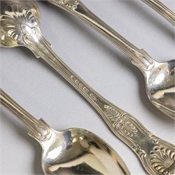 Seven silver Kings/Queens pattern dessert spoons, including George III Irish silver pair with engraved griffin crests, hallmarked Dublin 1818, maker's mark SI and five with varying dates and makers, all hallmarked 