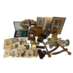 Quantity of mid 19th century and later photographs to include cartes des visites,  together with a small oval mirror, early 20th century clock, Bakelite cigarettes box, three hallmarked silver spoons, pair of Georgian spectacles with extending arms, silver and gold Plated reproduction icon, other silver plate and metal ware etc
