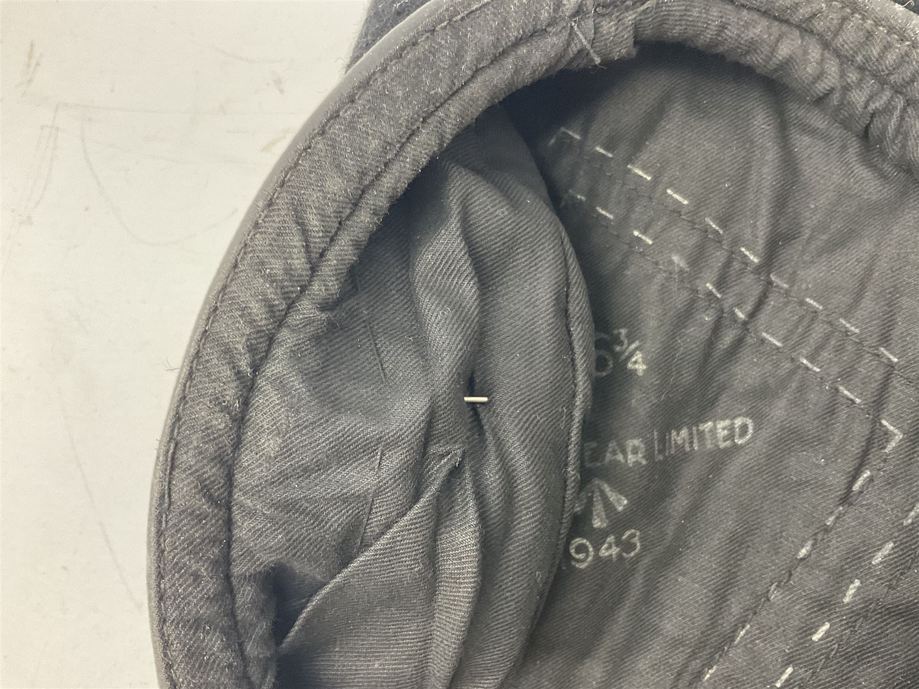 WW2 British black felt beret with Pioneer Corps cap badge, with Kangol Wear maker's mark dated 1943; and a British Army green webbing belt (2)