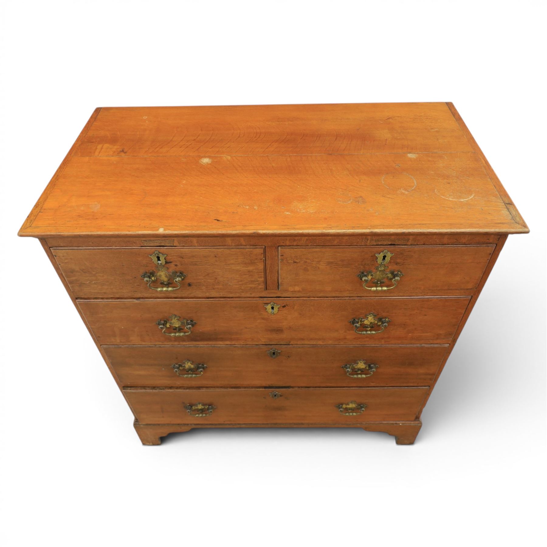18th century oak chest, moulded rectangular top, above two short over three long graduating drawers, fitted with pierced brass escutcheons and swan neck handles, on bracket feet 