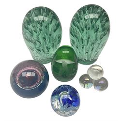 Pair of Victorian green glass dump paperweights with air bubble inclusions, together with Caithness paperweight and three other paperweights, dump H15cm