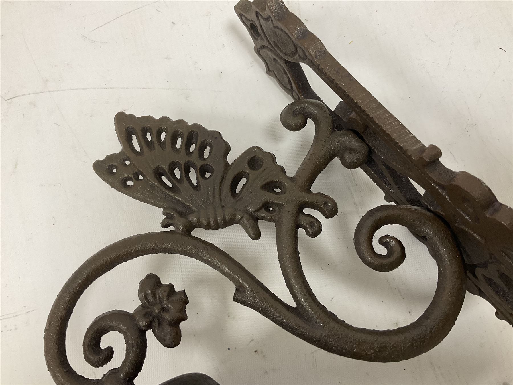 Cast iron exterior hanging garden bell with decorative butterfly bracket