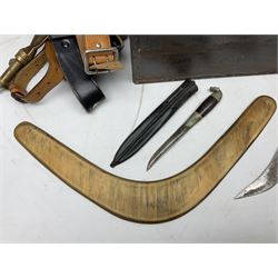 Assorted militaria including ten leather or canvas cartridge and other belts, maroon beret with 17th Lancers cap badge, modern bullet mould, leather and brass shot flask, two knives, shell cases, boomerang etc; in tin deed box