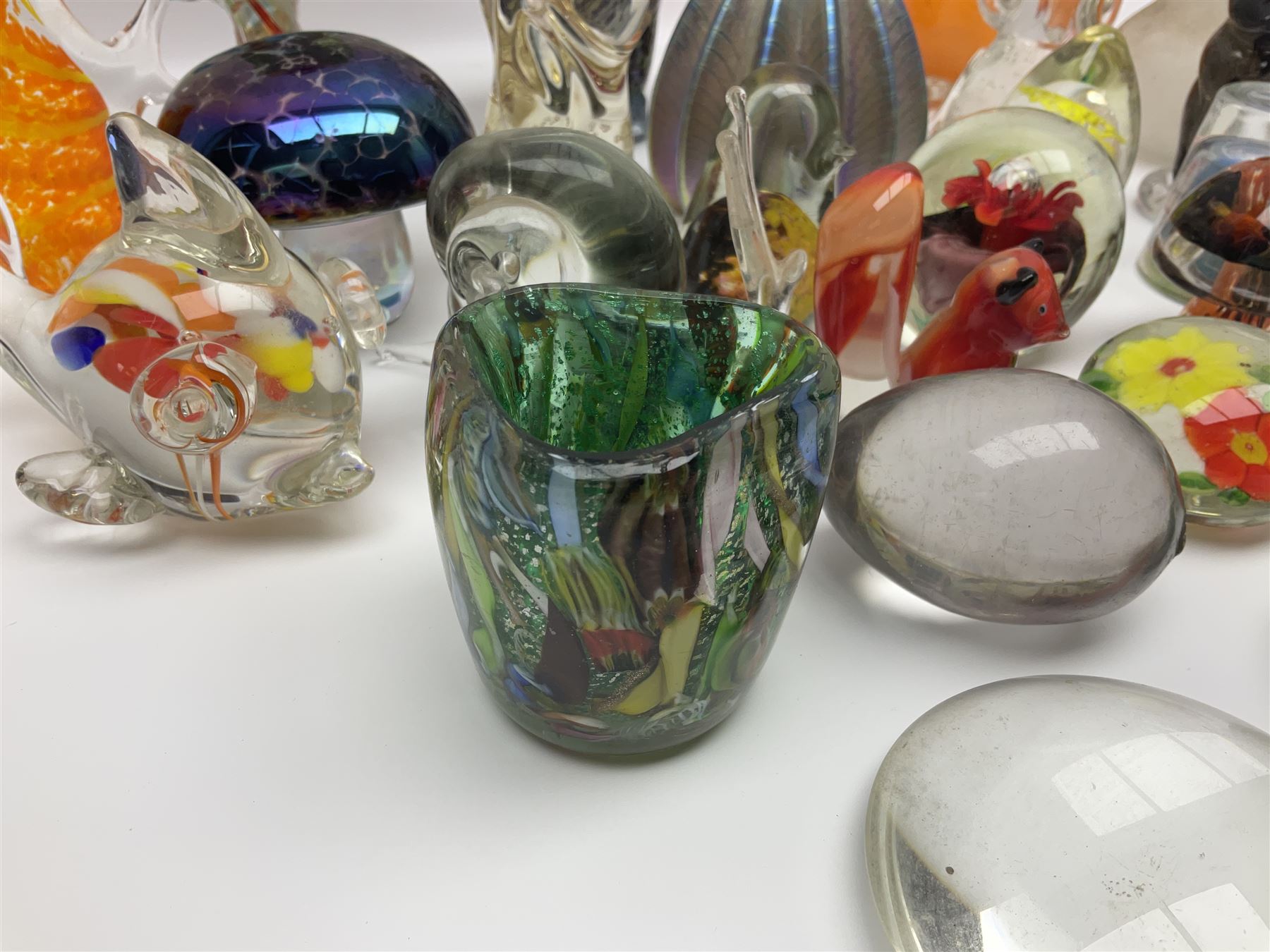 Robert Held iridescent art glass sea urchin paperweight, signed to underside, together with Murano glass clown and a collection of other glass paperweights and animals, etc 
